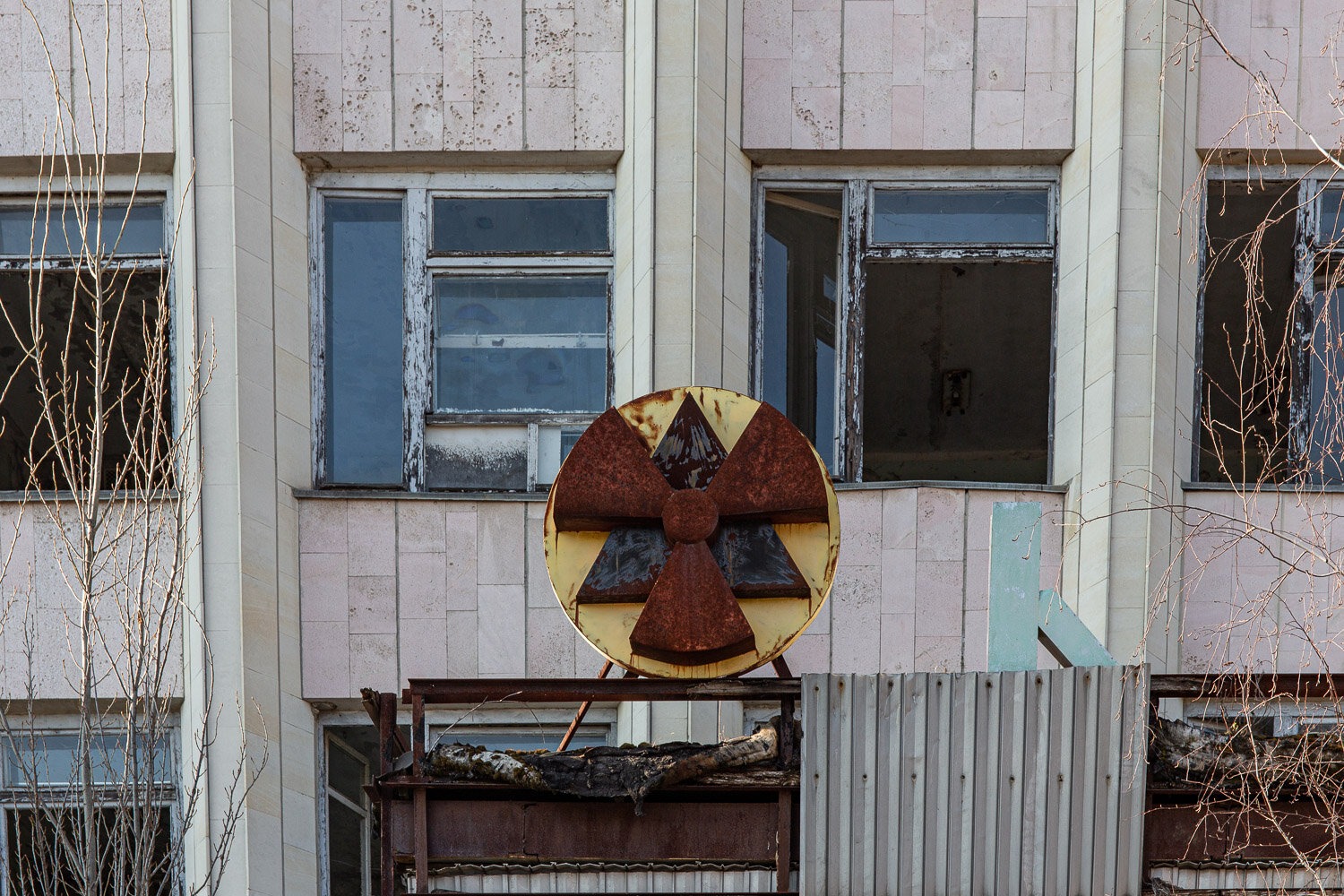 Main building in Pripyat with black and yellow radiation symbol